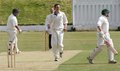 Damien Gudgeon leaves with a happy bowler looking on