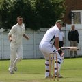 Adam Hornby watches a ball from Ross McMillan go by