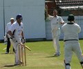 John Denwood watches Ikram Ullah take the catch to dismiss him off Ross McMillan's bowling