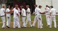 The Barrow players get together after the fall of a wicket 