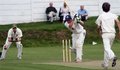 Adam Taylor drives the ball through the covers